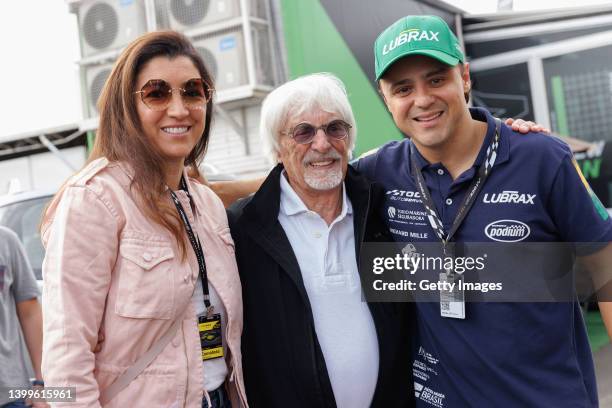 Bernie Ecclestone and his wife Fabiana Flosi pose for picture with Stock Car driver Felipe Massa during a visit to the Velocitta racetrack for a...