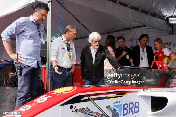 Bernie Ecclestone looks at Aurelia Nobels' F4 car during a visit to the Velocitta racetrack for a Stock Car and Formula 4 race on May 15, 2022 in...