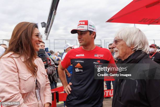 Driver Nelson Piquet Jr. Speaks with Bernie Ecclestone and his wife Fabiana Flosi during a visit to the Velocitta racetrack for a Stock Car and...