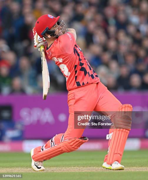 Lightning batsman Liam Livingstone hits a six during the Vitality T20 Blast match between Lancashire Lightning and Yorkshire Vikings at Emirates Old...