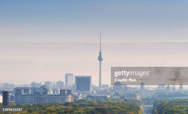berlin skyline with brandenburg gate and television tower - berlin stock-fotos und bilder