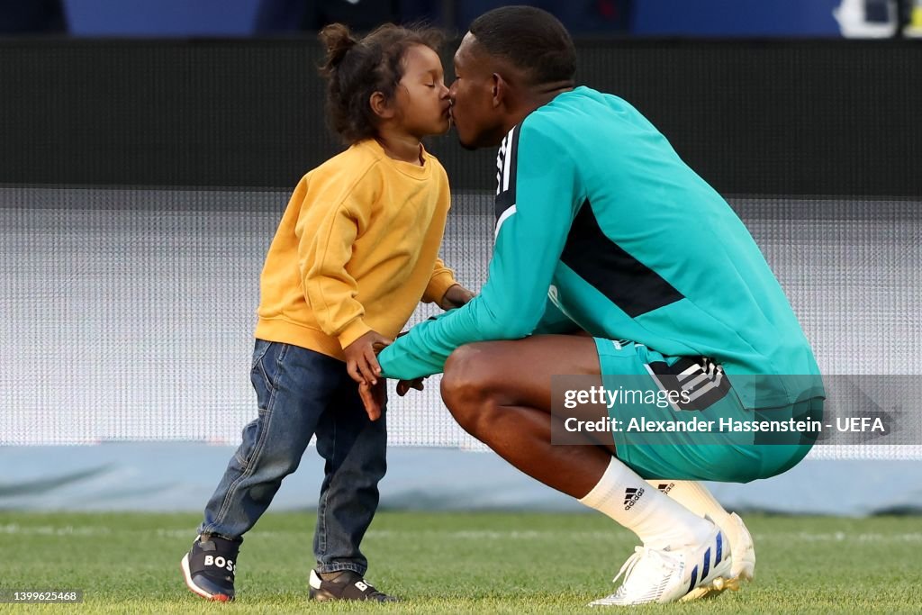David Alaba of Real Madrid inspects the pitch with family during