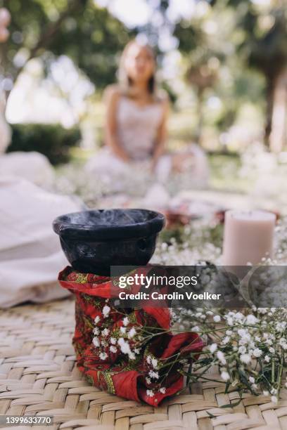 incense smoke burning in a ceremony - smudging ceremony stock pictures, royalty-free photos & images