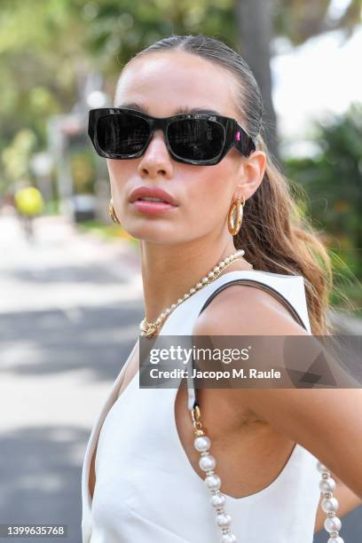 Hana Cross is seen posing during the 75th annual Cannes film festival at on May 26, 2022 in Cannes, France. Retouching Retouching