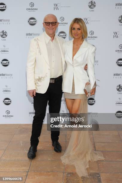 John Caudwell and Modesta Vzesniauskaite attends the Amber Lounge 2022 Fashion Show at Grimaldi Forum on May 27, 2022 in Monaco, Monaco.