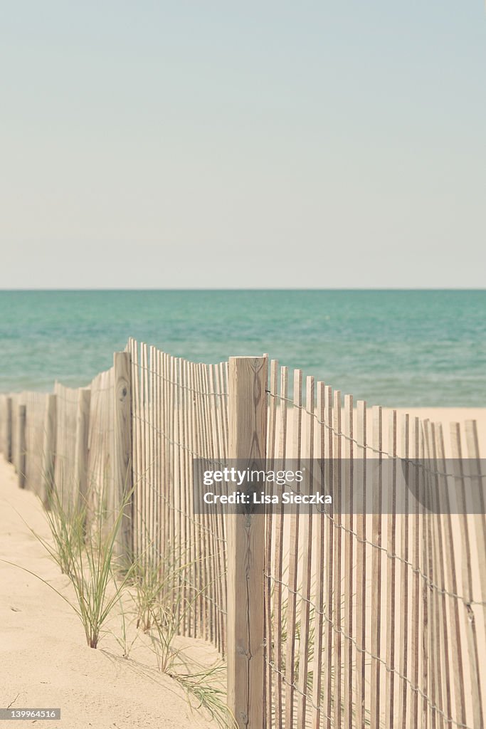 Fence on beach sand