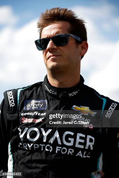 Landon Cassill, driver of the Voyager: Crypto for All Chevrolet, looks on during qualifying for the NASCAR Xfinity Series Alsco Uniforms 300 at...