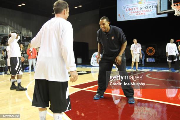 Honorary Coach Derrick Williams of the Minnesota Timberwolves runs a drill with a player before the NBA Cares/Special Olympics Unity Sports...