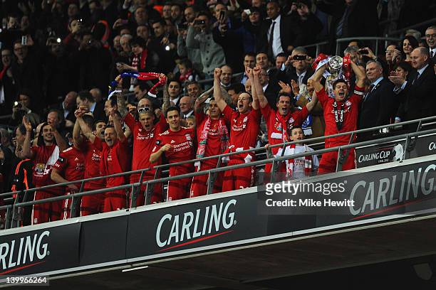 Steven Gerrard of Liverpool lifts the trophy in victory after the Carling Cup Final match between Liverpool and Cardiff City at Wembley Stadium on...