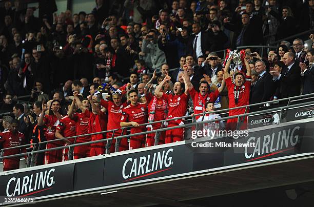 Steven Gerrard of Liverpool lifts the trophy in victory after the Carling Cup Final match between Liverpool and Cardiff City at Wembley Stadium on...
