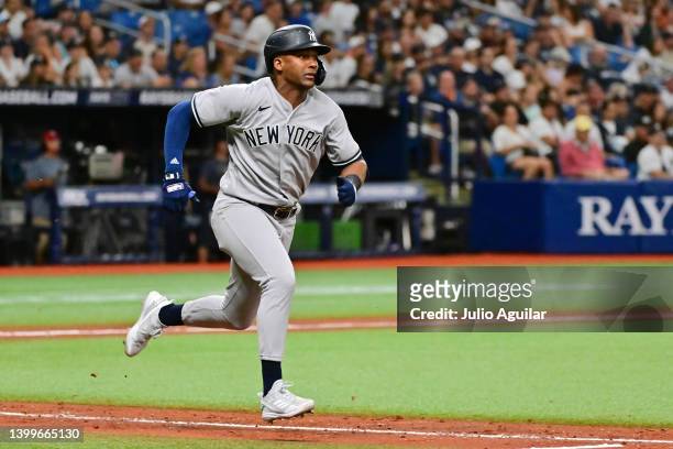 Miguel Andújar of the New York Yankees runs to second base after hitting a ground rule double in the ninth inning against the Tampa Bay Rays at...