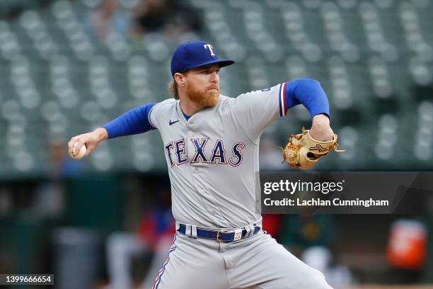 Jon Gray of the Texas Rangers pitches against the Oakland Athletics in the bottom of the first inning at RingCentral Coliseum on May 27, 2022 in...