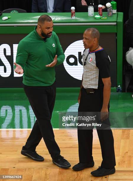 Head coach Ime Udoka of the Boston Celtics speaks with referee Eric Lewis during the second quarter against the Miami Heat in Game Six of the 2022...