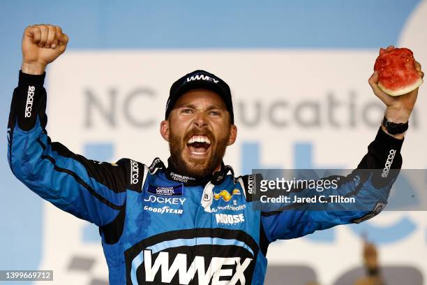 Ross Chastain, driver of the Worldwide Express Chevrolet, celebrates in victory lane after winning the NASCAR Camping World Truck Series North...