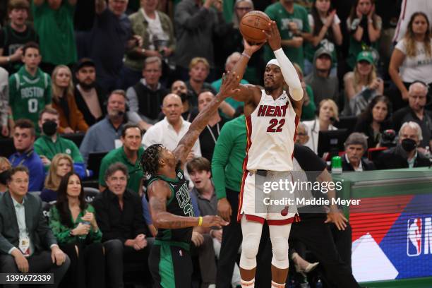 Jimmy Butler of the Miami Heat shoots a three point basket against Marcus Smart of the Boston Celtics during the fourth quarter in Game Six of the...