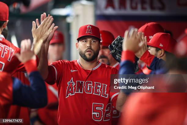 Ryan Tepera of the Los Angeles Angels reacts with teammates after pitching in the seventh inning against the Toronto Blue Jays at Angel Stadium of...