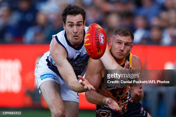 Jeremy Cameron of the Cats and Rory Laird of the Crows contest the ball during the round 11 AFL match between the Geelong Cats and the Adelaide Crows...