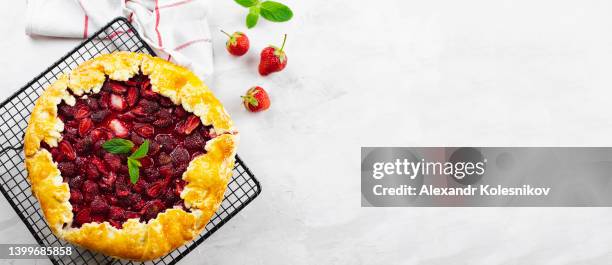 open pie or galette with strawberry on light stone background. top view - kazakhstan food stock pictures, royalty-free photos & images