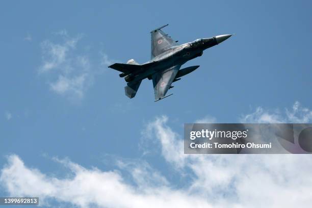 An F-2 fighter jet flies during a live fire exercise conducted by the Japan Ground Self-Defense Force at East Fuji Maneuver Area on May 28, 2022 in...