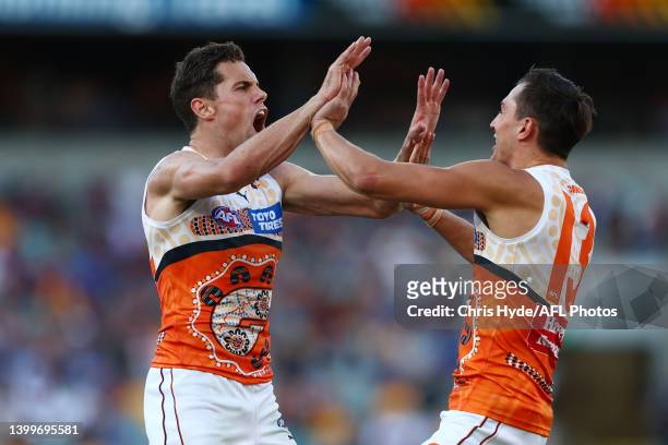 Josh Kelly of the Giants celebrates a goal during the round 11 AFL match between the Brisbane Lions and the Greater Western Sydney Giants at The...