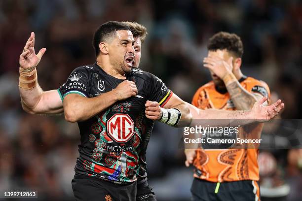Cody Walker of the Rabbitohs celebrates scoring a try during the round 12 NRL match between the South Sydney Rabbitohs and the Wests Tigers at Accor...