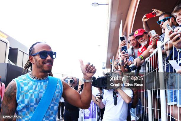 Lewis Hamilton of Great Britain and Mercedes greets fans at the circuit prior to final practice ahead of the F1 Grand Prix of Monaco at Circuit de...