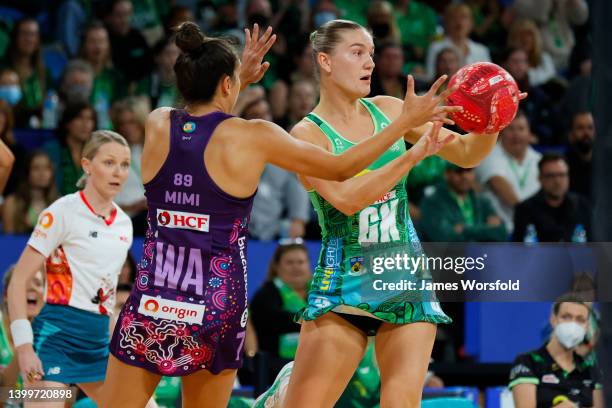 Courtney Bruce of the Fever passes the ball away during the round 12 Super Netball match between West Coast Fever and Queensland Firebirds at RAC...