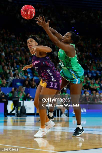 Jhaniele Fowler of the Fever reaches out for the ball during the round 12 Super Netball match between West Coast Fever and Queensland Firebirds at...