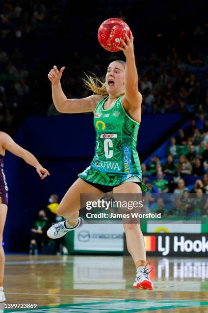 Zoe Cransberg of the Fever reaches out to the ball during the round 12 Super Netball match between West Coast Fever and Queensland Firebirds at RAC...