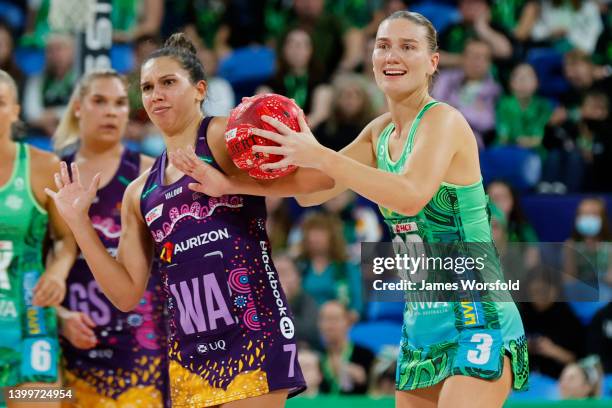 Courtney Bruce of the Fever looks to make a pass down the court during the round 12 Super Netball match between West Coast Fever and Queensland...