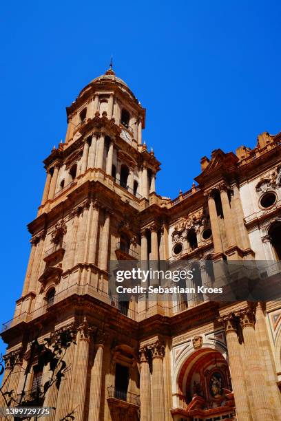 facade of the cathedral of malaga, tower, sunshine, spain - cidade velha imagens e fotografias de stock