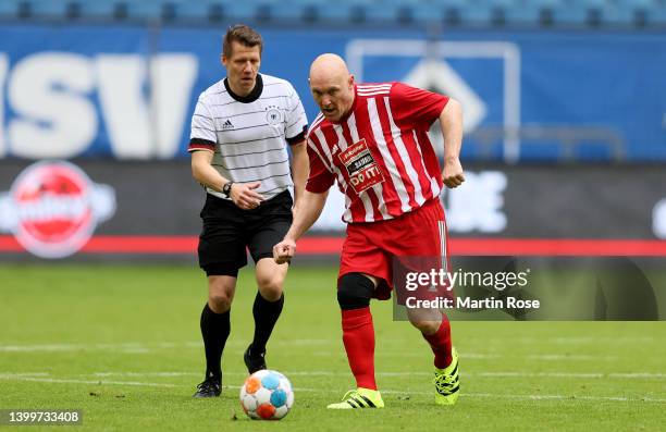 Patrick Ittrich of DFB-All-Stars challenges Thomas Gravesenof HSV-Legends during the charity match for Ukraine between DFB-All-Stars and HSV-Legends...