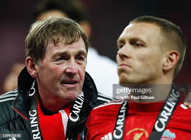 Kenny Dalglish manager of Liverpool talks to Craig Bellamy after victory after the Carling Cup Final match between Liverpool and Cardiff City at...