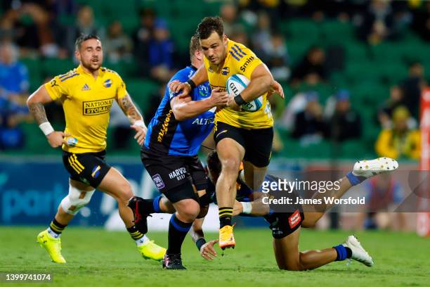 Wes Goosen of the Hurricanes attempts to break through the tackle during the round 15 Super Rugby Pacific match between the Western Force and the...