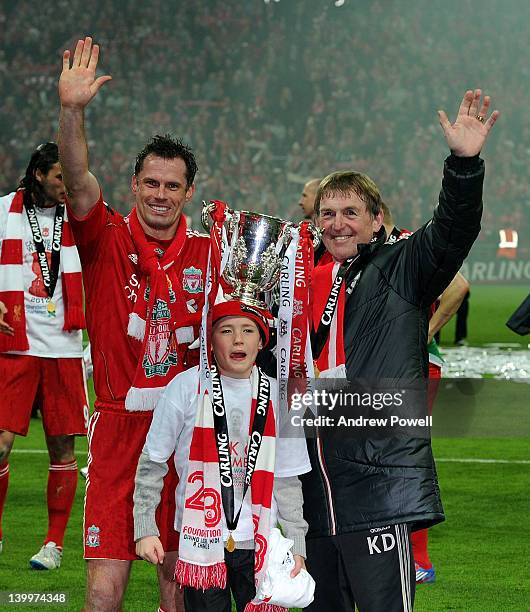 Jamie Carragher and Kenny Dalglish of Liverpool celebrate with the trophy at the end of the Carling Cup Final match between Liverpool and Cardiff...