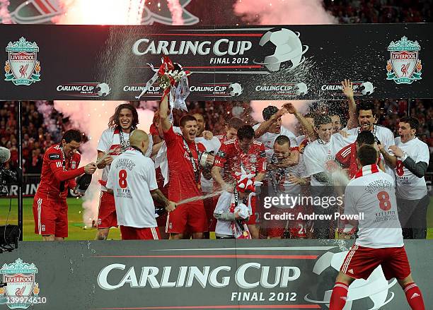 Liverpool team celebrate their win with the trophy at the end of the Carling Cup Final match between Liverpool and Cardiff City at Wembley Stadium on...
