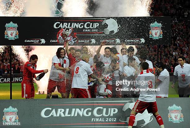 The Liverpool team celebrate their win with the trophy at the end of the Carling Cup Final match between Liverpool and Cardiff City at Wembley...