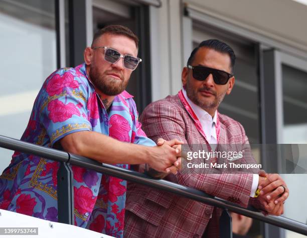 Conor McGregor watches the action from the pitlane during qualifying ahead of the F1 Grand Prix of Monaco at Circuit de Monaco on May 28, 2022 in...