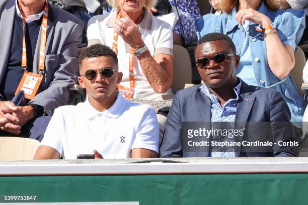 Marvin Desailly and Marcel Desailly attend the match of Rafael Nadal during day 6 of the French Open 2022 at Roland Garros on May 27, 2022 in Paris,...