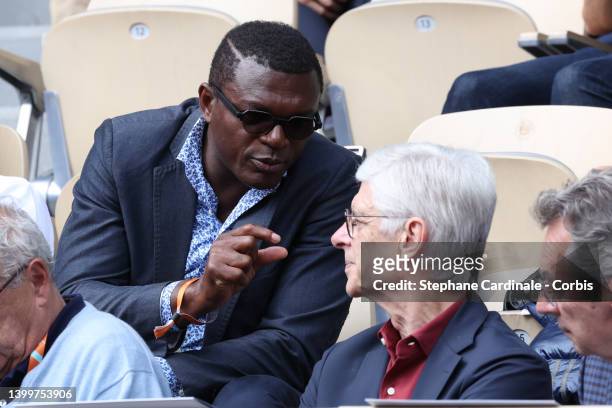 Marcel Desailly and Arsene Wenger attend the match of Rafael Nadal during day 6 of the French Open 2022 at Roland Garros on May 27, 2022 in Paris,...