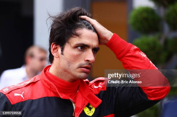 Second placed qualifier Carlos Sainz of Spain and Ferrari looks on in parc ferme after crashing during qualifying ahead of the F1 Grand Prix of...