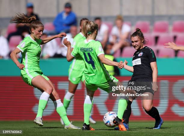 Jill Roord and Kathrin-Julia Hendrich of VfL Wolfsburg battle for possession with Sophie Weidauer of Turbine Potsdam during the Women's DFB Cup final...