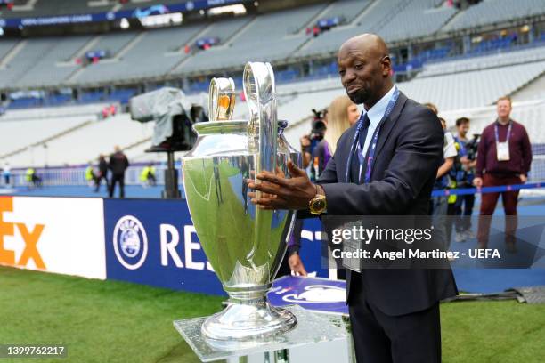 Claude Makelele places the UEFA Champions League trophy on a plinth prior to kick off of the UEFA Champions League final match between Liverpool FC...