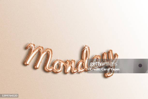 monday word spelled in  golden rose foil balloon - monday ストックフォトと画像