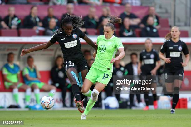 Teninsoun Liliane Sissoko of Turbine Potsdam is challenged by Ewa Pajor of VfL Wolfsburg during the Women's DFB Cup final match between VfL Wolfsburg...