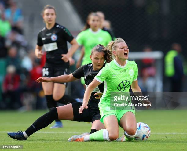 Alexandra Popp of VfL Wolfsburg battles for possession with Malgorzata Anna Mesjasz of Turbine Potsdam during the Women's DFB Cup final match between...