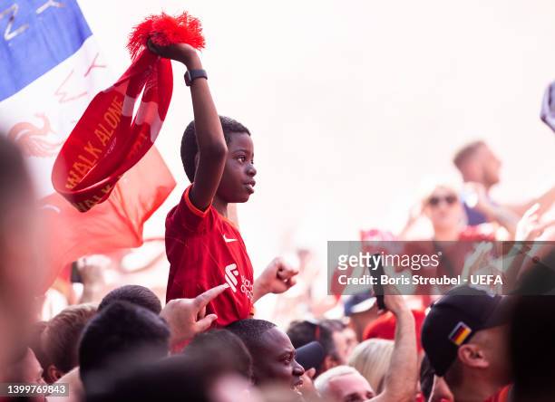 Fans 0f Liverpool FC celebrate at the Liverpool fan zone at Cours de Vincennes ahead of the UEFA Champions League final match between Liverpool FC...