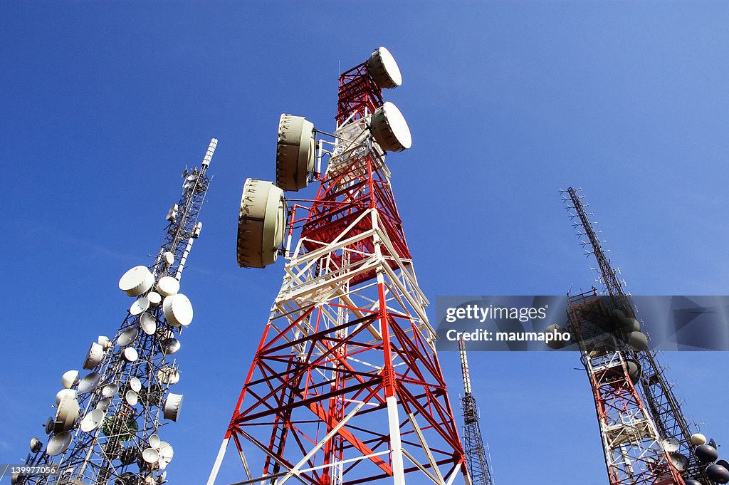 Telecommunications Tower, blu skye with clouds