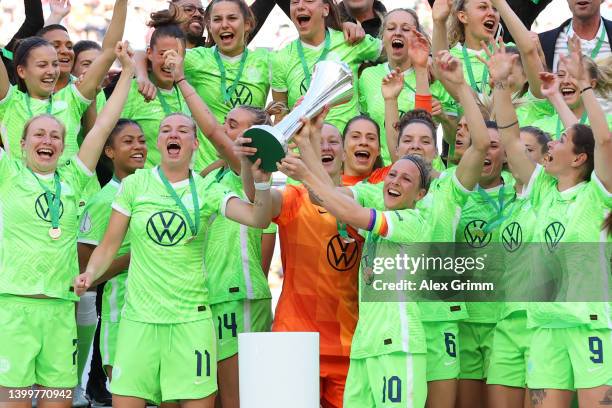 Alexandra Popp and Svenja Huth of VfL Wolfsburg lift the DFB-Pokal Frauen trophy after their sides victory during the Women's DFB Cup final match...