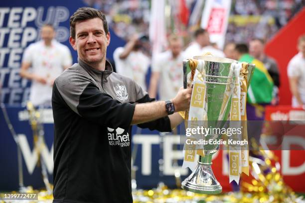 Darrell Clarke, Manager of Port Vale celebrates with the Sky Bet League Two Trophy after their sides victory in the Sky Bet League Two Play-off Final...